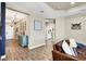 Bright entryway with teal cabinet and view to living room and hallway at 26812 Pavin Dr, Englewood, FL 34223
