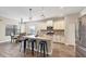 Modern kitchen with white cabinets, granite countertops, and stainless steel appliances at 26812 Pavin Dr, Englewood, FL 34223
