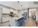 Modern kitchen with white cabinets, granite countertops, and stainless steel appliances at 26812 Pavin Dr, Englewood, FL 34223