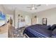 Large main bedroom with a king bed, walk-in closet, and access to bath at 26812 Pavin Dr, Englewood, FL 34223
