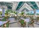 Relaxing outdoor seating area with green umbrellas and white tables at 26812 Pavin Dr, Englewood, FL 34223