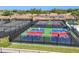 Aerial view of residents playing pickleball on well-maintained courts at 26812 Pavin Dr, Englewood, FL 34223