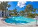Inviting resort-style pool with palm trees and lounge chairs at 26812 Pavin Dr, Englewood, FL 34223