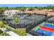Aerial view of tennis and pickleball courts within a community at 26812 Pavin Dr, Englewood, FL 34223