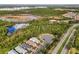 Aerial view of neighborhood featuring houses near a lake at 2759 Lavandula Ct, North Port, FL 34289