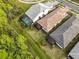 Aerial view of houses, pools, and lush green landscaping at 2759 Lavandula Ct, North Port, FL 34289