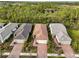 Aerial view of houses with red tile roofs and brick driveways at 2759 Lavandula Ct, North Port, FL 34289