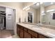 Double vanity bathroom with granite countertop and walk-in shower at 2759 Lavandula Ct, North Port, FL 34289