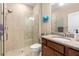 Bathroom features a walk-in shower and granite vanity at 2759 Lavandula Ct, North Port, FL 34289