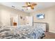 Bright bedroom with ensuite bathroom access and dresser at 2759 Lavandula Ct, North Port, FL 34289