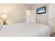 Spacious bedroom with a comfortable bed and plenty of closet space at 2759 Lavandula Ct, North Port, FL 34289