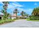Community center with palm trees and a parking area at 2759 Lavandula Ct, North Port, FL 34289