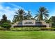 Community entrance with a water feature and landscaping at 2759 Lavandula Ct, North Port, FL 34289