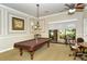 Game room with a pool table and comfortable seating at 2759 Lavandula Ct, North Port, FL 34289