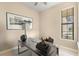 Bright home office features a glass desk and large window at 2759 Lavandula Ct, North Port, FL 34289