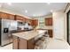 Modern kitchen with stainless steel appliances and granite island at 2759 Lavandula Ct, North Port, FL 34289