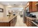 Kitchen features granite island, stainless steel appliances, and open layout at 2759 Lavandula Ct, North Port, FL 34289