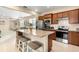 Modern kitchen with granite countertops and stainless steel appliances at 2759 Lavandula Ct, North Port, FL 34289
