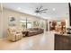 Spacious living room with light tile floors and comfy seating at 2759 Lavandula Ct, North Port, FL 34289