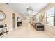 Open concept living room with hardwood floors and lots of natural light at 2759 Lavandula Ct, North Port, FL 34289