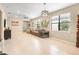 Open concept living room with hardwood floors and natural light at 2759 Lavandula Ct, North Port, FL 34289