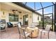 Relaxing screened patio with fire pit and seating at 2759 Lavandula Ct, North Port, FL 34289