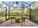 Covered patio with fire pit and view of backyard at 2759 Lavandula Ct, North Port, FL 34289