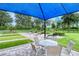 Enjoy a game of shuffleboard under a shaded patio at 2759 Lavandula Ct, North Port, FL 34289
