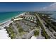 Aerial view of community tennis courts and beach at 5850 Gasparilla Rd # M7, Boca Grande, FL 33921
