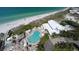 Aerial view showing pool, clubhouse, and beach access at 5850 Gasparilla Rd # M7, Boca Grande, FL 33921