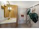 Modern bathroom with updated vanity, gold fixtures, and a walk-in shower at 5850 Gasparilla Rd # M7, Boca Grande, FL 33921