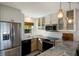 Modern kitchen with stainless steel appliances and marble countertops at 5850 Gasparilla Rd # M7, Boca Grande, FL 33921