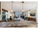 Modern kitchen with stainless steel appliances and marble countertops at 5850 Gasparilla Rd # M7, Boca Grande, FL 33921