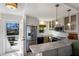 Modern kitchen with stainless steel appliances and marble countertops at 5850 Gasparilla Rd # M7, Boca Grande, FL 33921