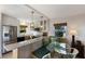 Modern kitchen with stainless steel appliances and marble countertops at 5850 Gasparilla Rd # M7, Boca Grande, FL 33921