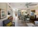 Open living area with kitchen, dining, and sitting areas at 5850 Gasparilla Rd # M7, Boca Grande, FL 33921