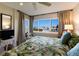 Main bedroom with stunning water views from large windows at 5850 Gasparilla Rd # M7, Boca Grande, FL 33921
