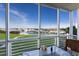 Enjoy water views from this screened porch with outdoor seating at 5850 Gasparilla Rd # M7, Boca Grande, FL 33921