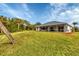Large backyard with canal view and lush lawn at 7297 Jennifer Dr, Port Charlotte, FL 33981