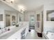 Large bathroom with double vanity, soaking tub, and walk-in shower at 7297 Jennifer Dr, Port Charlotte, FL 33981