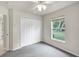 Well-lit bedroom with double doors and window at 7297 Jennifer Dr, Port Charlotte, FL 33981