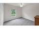Spacious bedroom with carpet and large window at 7297 Jennifer Dr, Port Charlotte, FL 33981