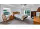Spacious bedroom with wood furniture and sliding glass door access to patio at 7297 Jennifer Dr, Port Charlotte, FL 33981