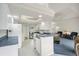 Bright kitchen with white cabinets, blue countertops, and breakfast bar at 7297 Jennifer Dr, Port Charlotte, FL 33981