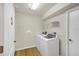 Laundry room with washer, dryer, and shelving at 7297 Jennifer Dr, Port Charlotte, FL 33981