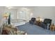 Spacious living room with a view to the kitchen and access to the outside at 7297 Jennifer Dr, Port Charlotte, FL 33981