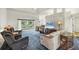 Bright living room with comfortable seating and access to a patio at 7297 Jennifer Dr, Port Charlotte, FL 33981