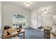 Home office with wood desk and view of front yard at 7297 Jennifer Dr, Port Charlotte, FL 33981