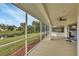 Screened porch with water view and ceiling fan at 7297 Jennifer Dr, Port Charlotte, FL 33981