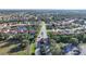 Aerial view of community entrance and homes at 8527 Creekview Ln, Englewood, FL 34224